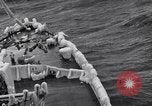 Image of Sailors chop ice from Japanese light cruiser Aleutians, 1942, second 37 stock footage video 65675031675