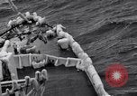 Image of Sailors chop ice from Japanese light cruiser Aleutians, 1942, second 38 stock footage video 65675031675