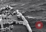 Image of Sailors chop ice from Japanese light cruiser Aleutians, 1942, second 40 stock footage video 65675031675