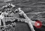 Image of Sailors chop ice from Japanese light cruiser Aleutians, 1942, second 42 stock footage video 65675031675