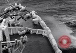 Image of Sailors chop ice from Japanese light cruiser Aleutians, 1942, second 43 stock footage video 65675031675