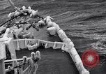 Image of Sailors chop ice from Japanese light cruiser Aleutians, 1942, second 44 stock footage video 65675031675