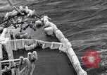 Image of Sailors chop ice from Japanese light cruiser Aleutians, 1942, second 45 stock footage video 65675031675