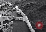 Image of Sailors chop ice from Japanese light cruiser Aleutians, 1942, second 47 stock footage video 65675031675