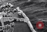Image of Sailors chop ice from Japanese light cruiser Aleutians, 1942, second 49 stock footage video 65675031675