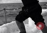 Image of Sailors chop ice from Japanese light cruiser Aleutians, 1942, second 50 stock footage video 65675031675