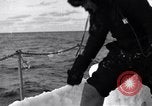 Image of Sailors chop ice from Japanese light cruiser Aleutians, 1942, second 51 stock footage video 65675031675