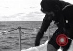 Image of Sailors chop ice from Japanese light cruiser Aleutians, 1942, second 53 stock footage video 65675031675