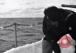 Image of Sailors chop ice from Japanese light cruiser Aleutians, 1942, second 54 stock footage video 65675031675