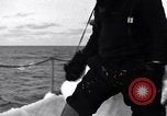 Image of Sailors chop ice from Japanese light cruiser Aleutians, 1942, second 55 stock footage video 65675031675