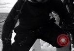 Image of Sailors chop ice from Japanese light cruiser Aleutians, 1942, second 56 stock footage video 65675031675