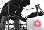 Image of Sailors chop ice from Japanese light cruiser Aleutians, 1942, second 57 stock footage video 65675031675