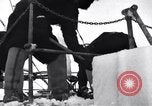 Image of Sailors chop ice from Japanese light cruiser Aleutians, 1942, second 58 stock footage video 65675031675