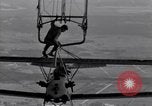 Image N2Y-1 avion d'entraînement des crochets sur et est hissé à bord de l'USS Akron United States USA, 1932, de la seconde 31 séquences d'archives historiques vidéo 65675031703