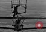 Image N2Y-1 avion d'entraînement des crochets sur et est hissé à bord de l'USS Akron United States USA, 1932, de la seconde 33 séquences d'archives historiques vidéo 65675031703