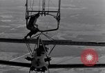Image N2Y-1 avion d'entraînement des crochets sur et est hissé à bord de l'USS Akron United States USA, 1932, de la seconde 35 séquences d'archives historiques vidéo 65675031703