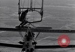 Image N2Y-1 avion d'entraînement des crochets sur et est hissé à bord de l'USS Akron United States USA, 1932, de la seconde 37 séquences d'archives historiques vidéo 65675031703
