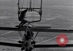 Image N2Y-1 avion d'entraînement des crochets sur et est hissé à bord de l'USS Akron United States USA, 1932, de la seconde 38 séquences d'archives historiques vidéo 65675031703