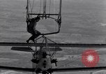 Image N2Y-1 avion d'entraînement des crochets sur et est hissé à bord de l'USS Akron United States USA, 1932, de la seconde 46 séquences d'archives historiques vidéo 65675031703