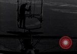 Image N2Y-1 avion d'entraînement des crochets sur et est hissé à bord de l'USS Akron United States USA, 1932, de la seconde 52 séquences d'archives historiques vidéo 65675031703