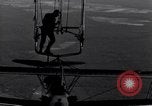 Image N2Y-1 avion d'entraînement des crochets sur et est hissé à bord de l'USS Akron United States USA, 1932, de la seconde 53 séquences d'archives historiques vidéo 65675031703