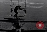 Image N2Y-1 avion d'entraînement des crochets sur et est hissé à bord de l'USS Akron United States USA, 1932, de la seconde 54 séquences d'archives historiques vidéo 65675031703