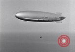 Image USS Akron avec plusieurs Consolidated N2Y-1 les avions en vol New Jersey United States USA, 1932, de la seconde 31 séquences d'archives historiques vidéo 65675031711