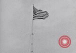 Image Drapeau américain dans le vent très rigide Dearborn Michigan USA, 1941, de la seconde 12 séquences d'archives historiques vidéo 65675031865