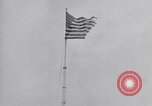 Image Drapeau américain dans le vent très rigide Dearborn Michigan USA, 1941, de la seconde 13 séquences d'archives historiques vidéo 65675031865