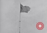 Image Drapeau américain dans le vent très rigide Dearborn Michigan USA, 1941, de la seconde 18 séquences d'archives historiques vidéo 65675031865