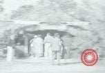Image of tourists at Seminole Native American Indian trading post Miami Florida USA, 1936, second 1 stock footage video 65675031908