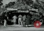Image of tourists at Seminole Native American Indian trading post Miami Florida USA, 1936, second 3 stock footage video 65675031908