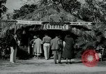 Image of tourists at Seminole Native American Indian trading post Miami Florida USA, 1936, second 4 stock footage video 65675031908
