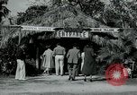 Image of tourists at Seminole Native American Indian trading post Miami Florida USA, 1936, second 5 stock footage video 65675031908