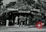 Image of tourists at Seminole Native American Indian trading post Miami Florida USA, 1936, second 8 stock footage video 65675031908