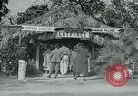 Image of tourists at Seminole Native American Indian trading post Miami Florida USA, 1936, second 10 stock footage video 65675031908