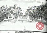 Image of car on a road Miami Florida USA, 1936, second 11 stock footage video 65675031913