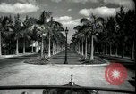 Image of car on a road Miami Florida USA, 1936, second 14 stock footage video 65675031913