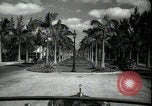 Image of car on a road Miami Florida USA, 1936, second 17 stock footage video 65675031913