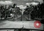 Image of car on a road Miami Florida USA, 1936, second 18 stock footage video 65675031913