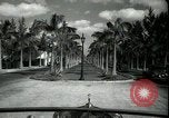 Image of car on a road Miami Florida USA, 1936, second 19 stock footage video 65675031913