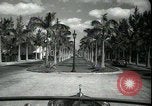 Image of car on a road Miami Florida USA, 1936, second 21 stock footage video 65675031913