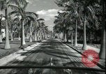 Image of car on a road Miami Florida USA, 1936, second 37 stock footage video 65675031913