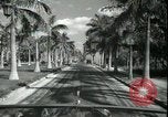 Image of car on a road Miami Florida USA, 1936, second 39 stock footage video 65675031913