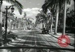 Image of car on a road Miami Florida USA, 1936, second 49 stock footage video 65675031913
