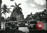 Image of car on a road Miami Florida USA, 1936, second 55 stock footage video 65675031913