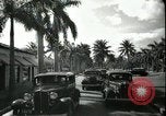 Image of car on a road Miami Florida USA, 1936, second 62 stock footage video 65675031913