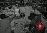 Image of 1930s tourists in swim suits West Palm Beach Florida USA, 1936, second 14 stock footage video 65675031920