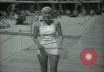 Image of 1930s tourists in swim suits West Palm Beach Florida USA, 1936, second 35 stock footage video 65675031920