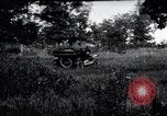 Image of camping in car United States USA, 1920, second 1 stock footage video 65675031931